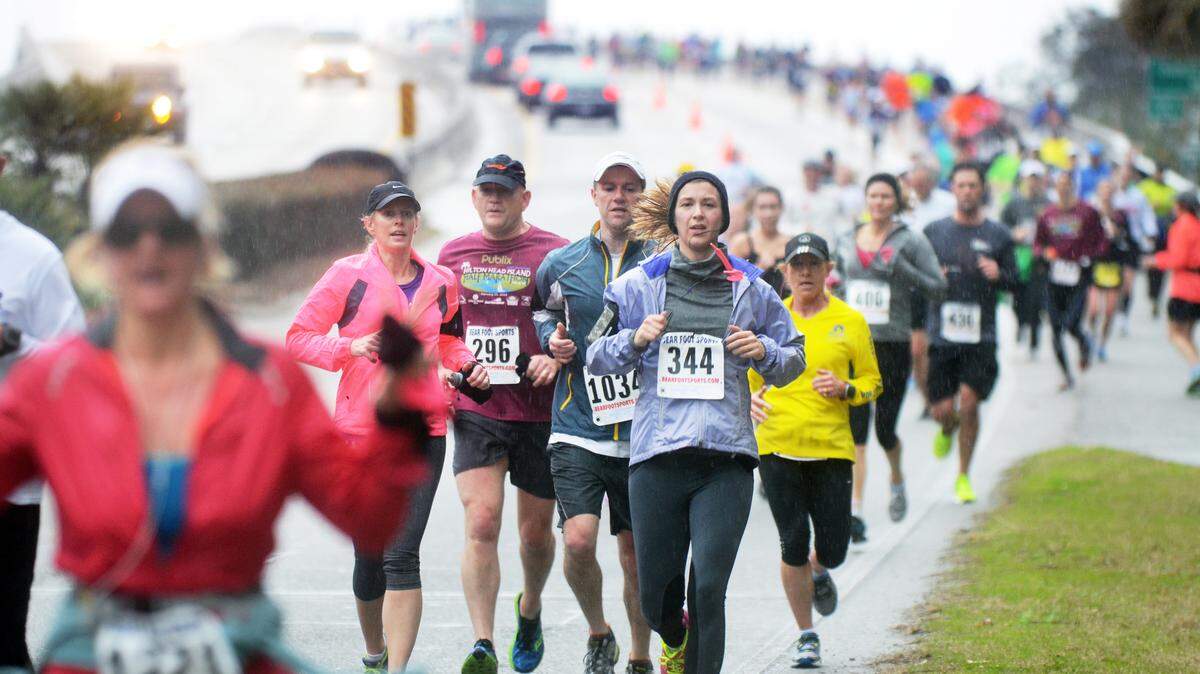 A sea of humanity pours down the eastern slope of the Charles E. Fraser Bridge as a light rain falls during Saturday's Hilton Head Island Marathon, Half Marathon & 5K. The event started at Jarvis Creek Park, ran up and down the Cross Island Parkway, through the Crossings Park, and along Spanish Wells Road before finishing back at Jarvis Creek Park.