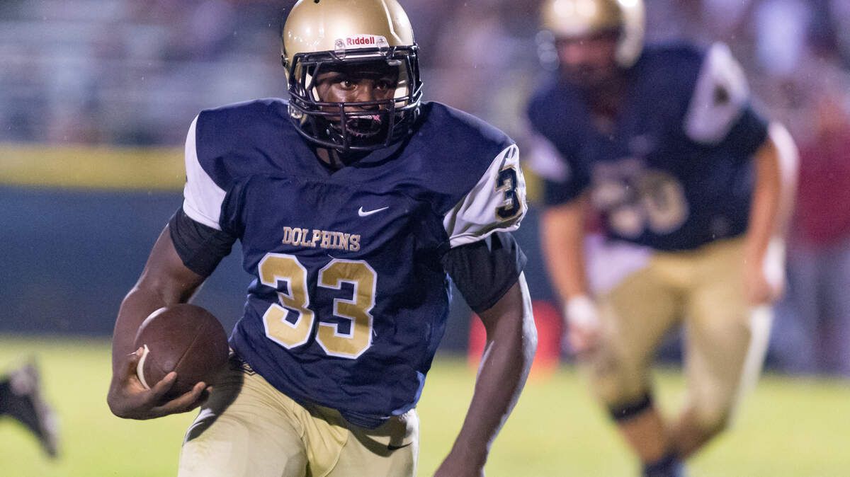 Senior running back Jeremiah Dilbert (33) runs the ball as Battery Creek fell in its season opener hosting Thomas Heyward Academy 44-3 on Friday, Aug. 27, 2021 in Beaufort.