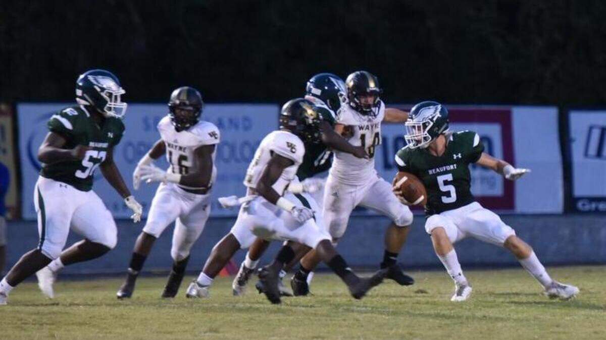Beaufort High School QB Jeffrey Smyth searches for an opening during the Eagles’ first possession of the game Friday night vs Georgia’s Wayne County High School.