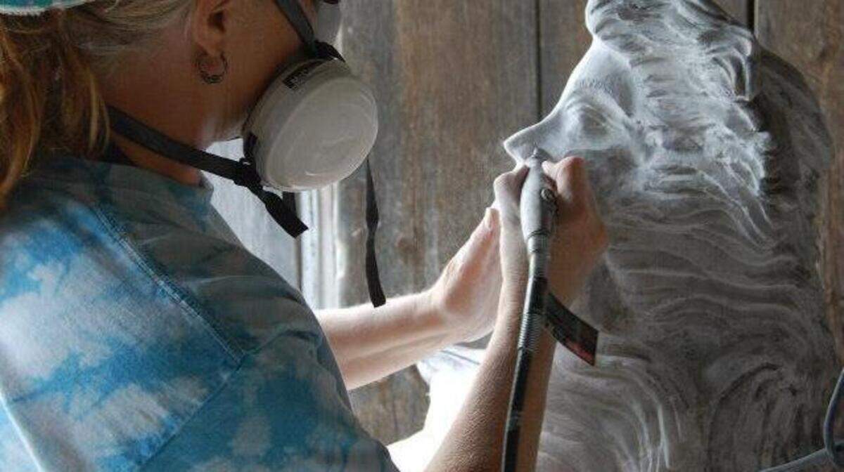 Karen Brodie works on one of her sculptures.