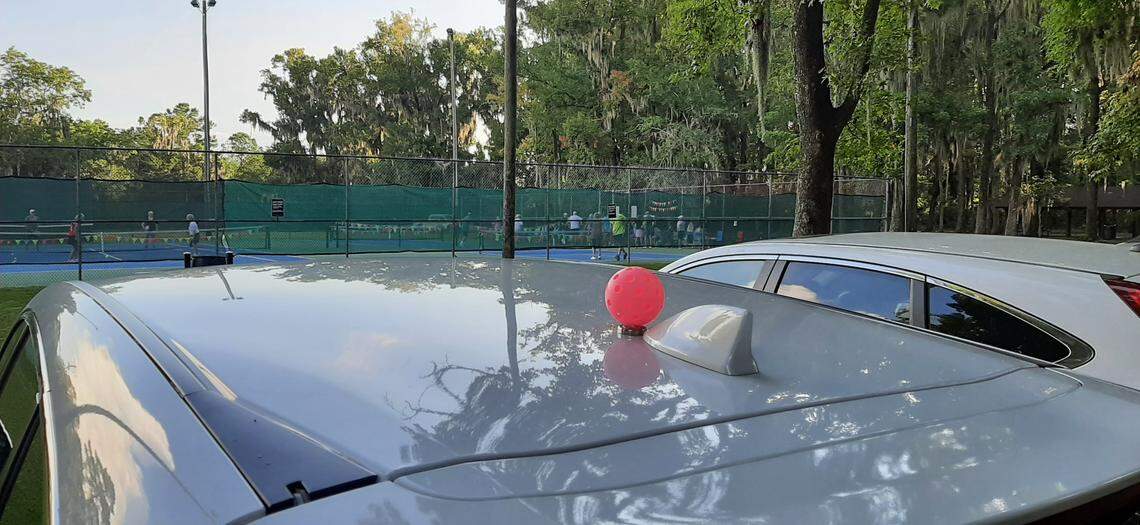 It’s hard to miss pickleball coach Jeff Conradi’s vehicle in the parking lot. It has a pickleball mounted on the top.
