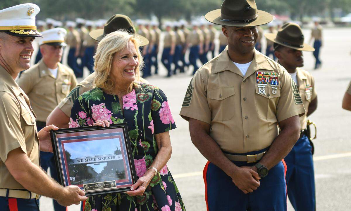 First Lady Jill Biden is given a ceremonial framed photo after speaking at the graduation ceremony on Friday June 30, 2023 at Marine Corps Recruit Depot Parris Island. The visit was part of a White House initiative started in 2011 by then First Lady Michelle Obama and Biden called Joining Forces to assist military members and their families through education, employment opportunities and wellness programs.
