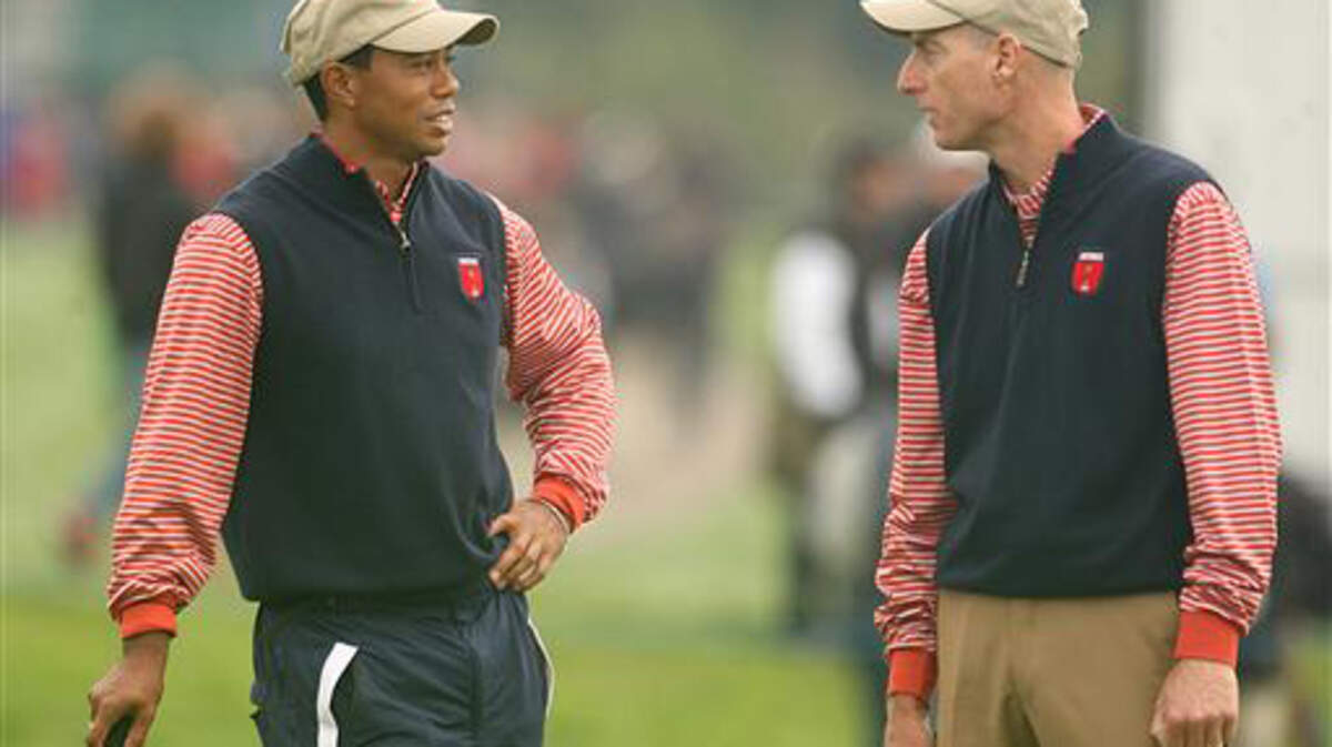 Tiger Woods and teammate Jim Furyk (right) during practice at the 2010 Ryder Cup.