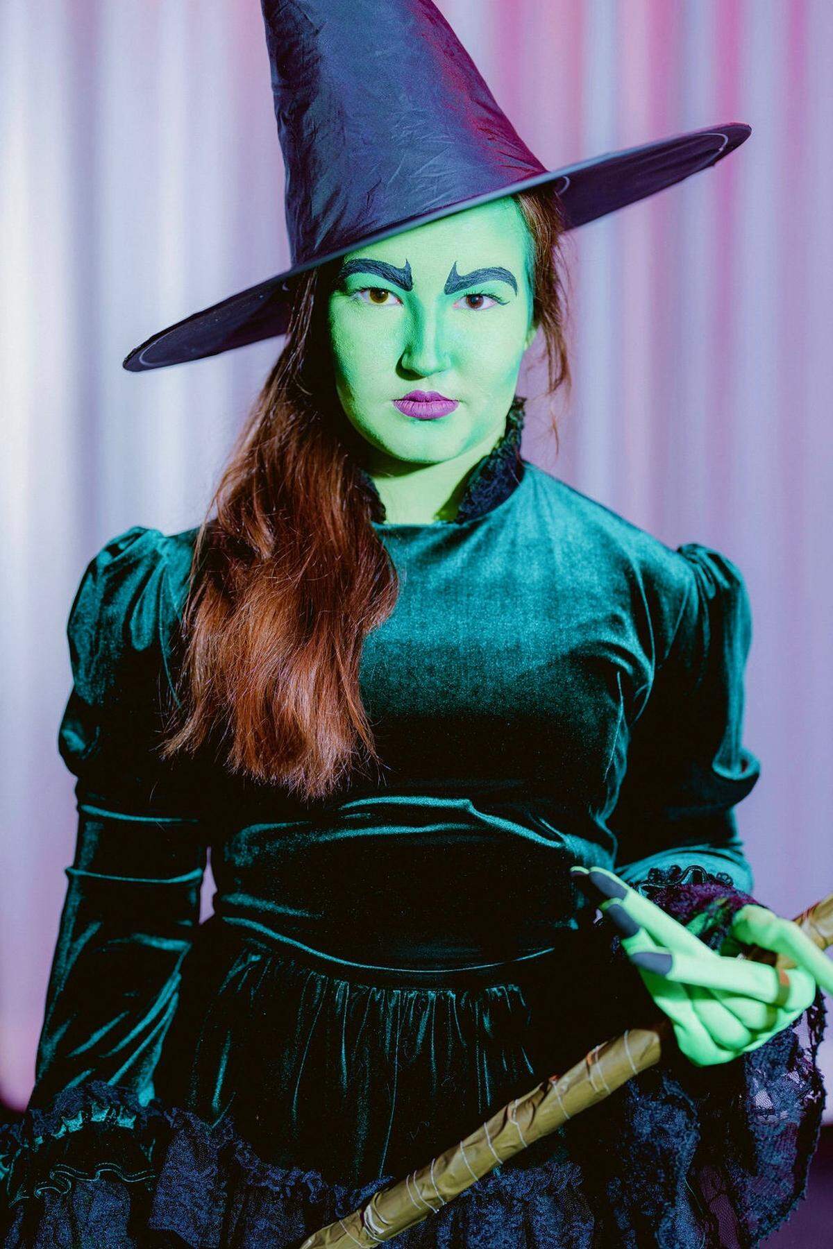 Emma Knight portrays the Wicked Witch of the West.