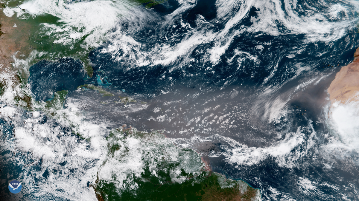A plume of Saharan dust appears over the Atlantic Ocean on June 27, 2018. These plumes of dust mobilize every year and help nourish microorganisms and suppress tropical storms.