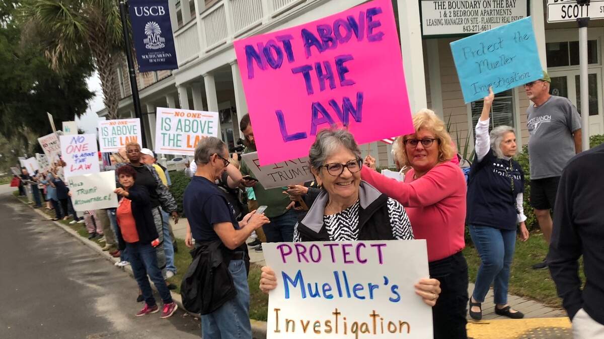 Protesters demonstrate against President Donald Trump firing Attorney General Jeff Sessions on Thursday along Boundary Street in Beaufort.