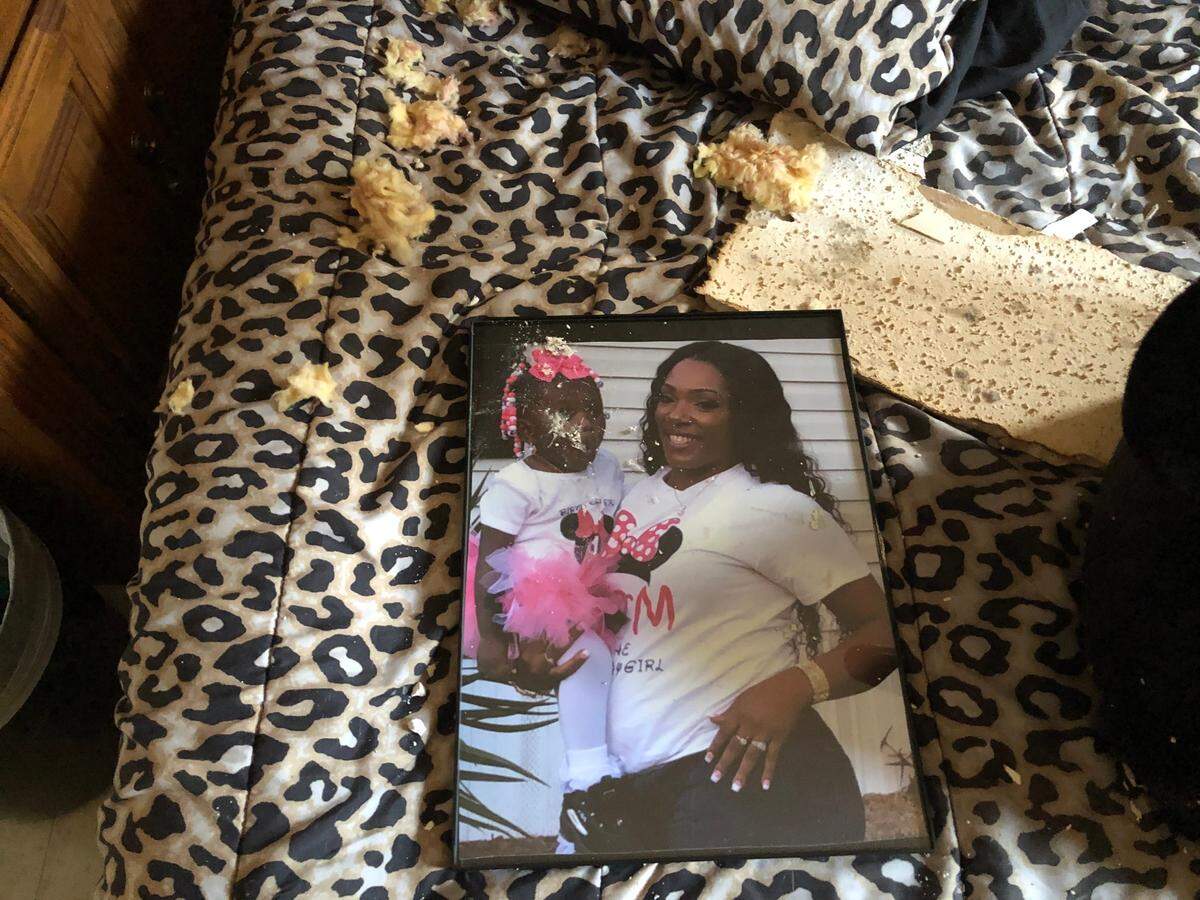 A photo of Briana Cohen and her daughter was affected by fallout from a fire at her Sandalwood Terrace apartment.