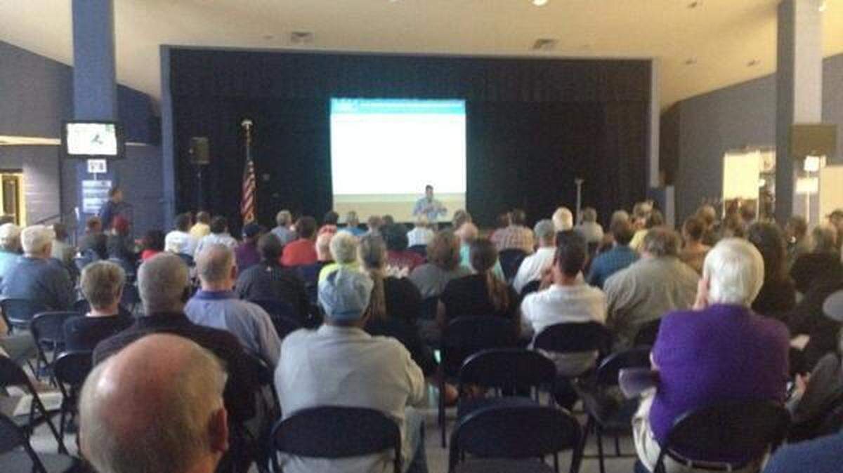 Scores of people filled a meeting space at Whale Branch Middle School for a community meeting with state environmental officials April 22, 2014, about a jellyfish processing operation planned for Port Royal.