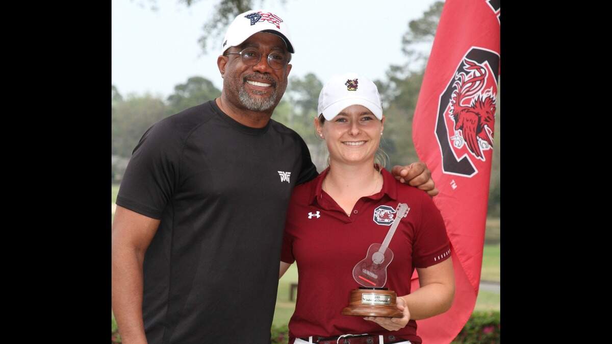 Mathilde Claisse with the University of South Carolina took home the individual trophy in the 2023 Darius Rucker Intercollegiate held at Long Cove Club on Hilton Head Island. She is photographed with Darius Rucker.