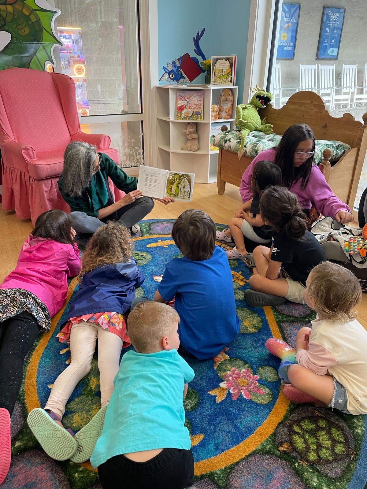 Kids listen to local authors read books during the Storybook Shoppe’s grand opening March 9, 2024.