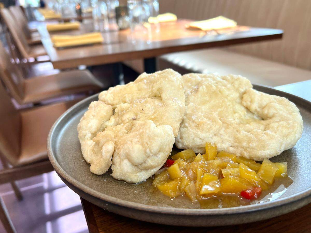 Bara is a flatbread popular in Trinidadian cuisine. Okan serves it with mango chutney.