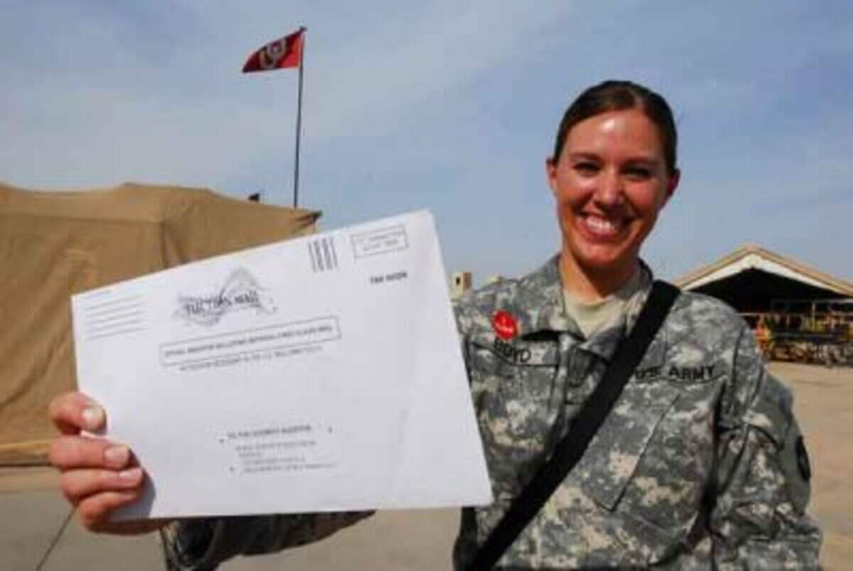 “Even though we are overseas, I wanted to make sure our voices are heard,” said Spc. Andrea Boyd, aviation supply specialist of Task Force 34, B Company, 834th Aviation Support Battalion at Joint Base Balad, Iraq, in 2008. The native of Ankeny, Iowa, holds the election ballot she received in the mail.
