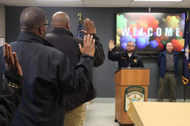 Jasper County Sheriff Chris Malphrus (center) swore in eight former detention officers as sheriff’s deputies on Jan. 12, 2025, beginning his department’s oversight of the Jasper County Detention Center. A ninth officer will be sworn in on a later date.