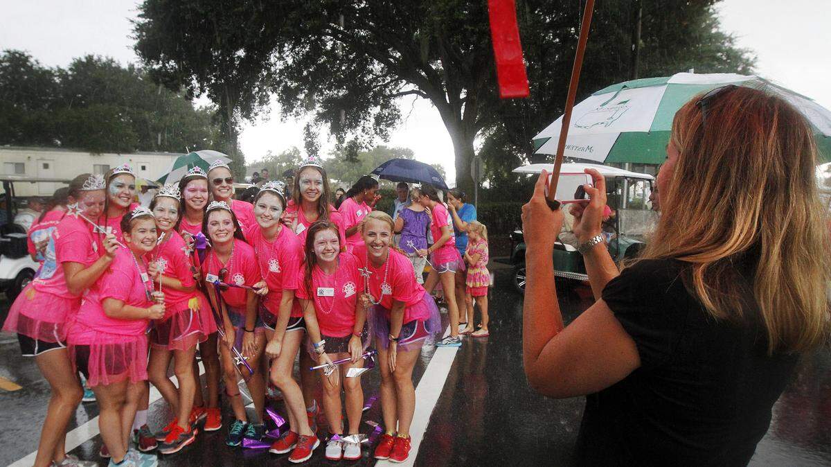The 2014 Beaufort Water Festival Pirettes pose at the finish line after competing in the 59th Beaufort Water Festival's Bed Race on Bay Street on July 25.