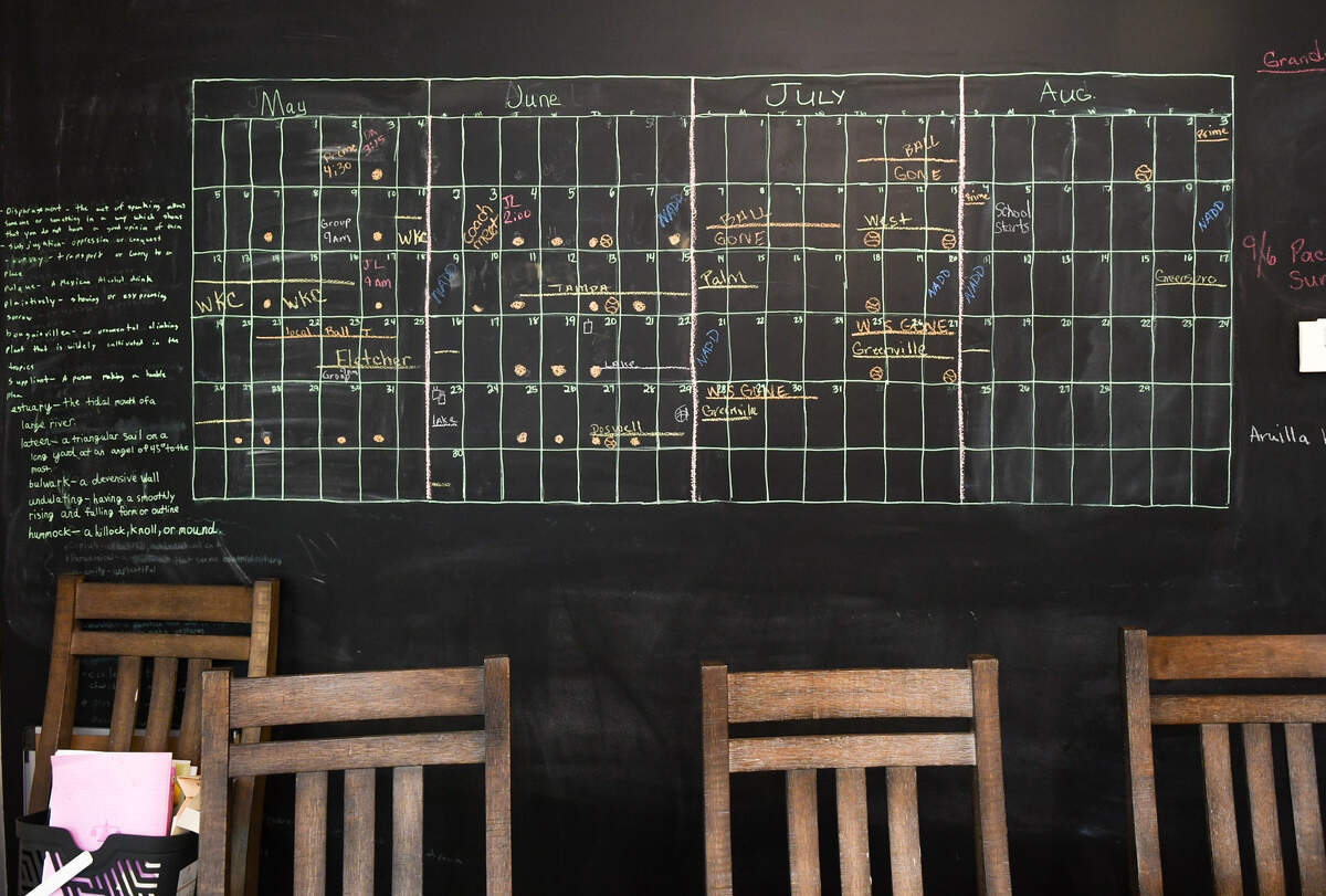 The Lancaster’s busy dog show schedule, which includes a brother who plays baseball, is chalked in on the wall in the family’s dining room as photographed on May 21, 2024 at their home in Ridgeland, S.C.