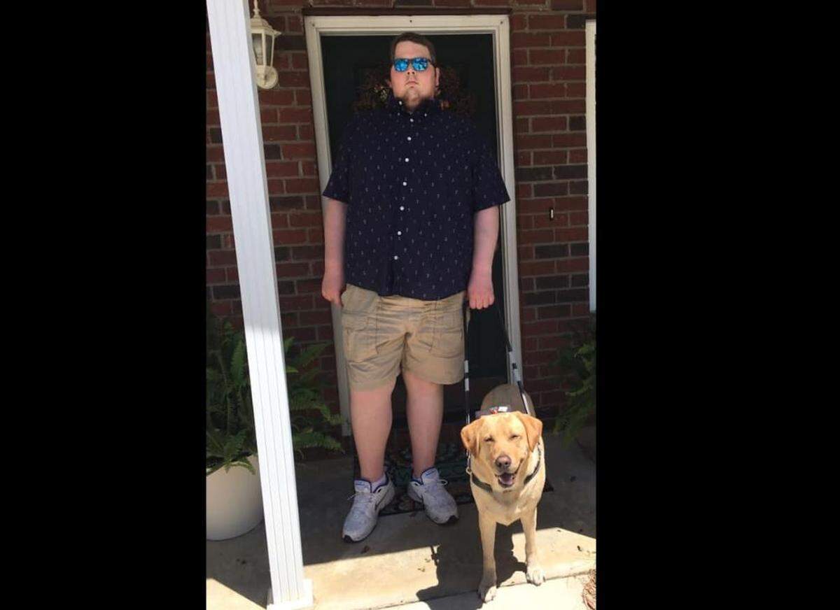 Taylor Burch and his service dog.