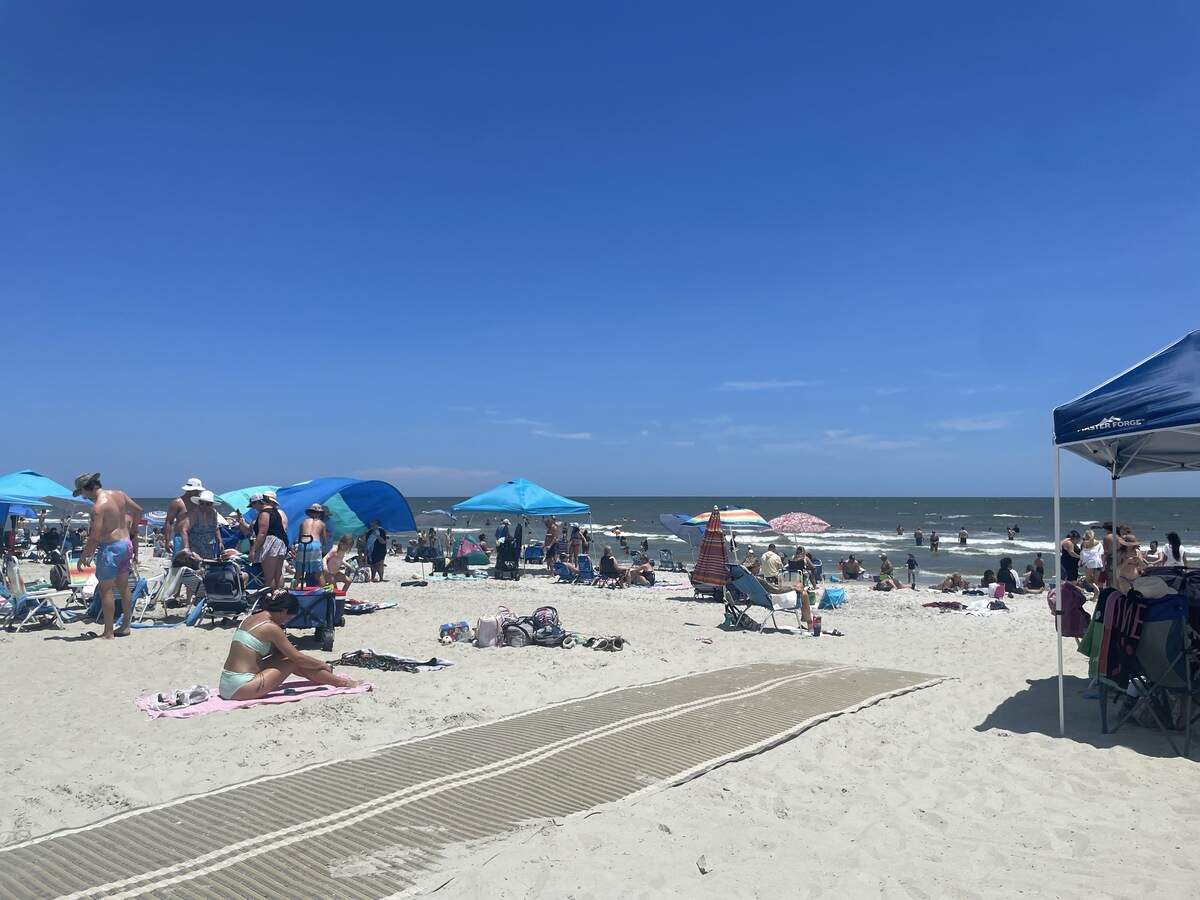 Tourists pack Coligny Beach on Monday, July 6, 2026, less than 48 hours after a shooting on the evening of the Fourth of July sent crowds running.