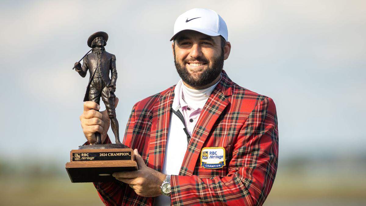 Scottie Scheffler presents his newly won Sir William Innes trophy after a rain delay pushed the final round of the RBC Heritage Presented by Boeing at Harbour Town Golf Links to Monday, April 22, 2024 in Sea Pines on Hilton Head Island.