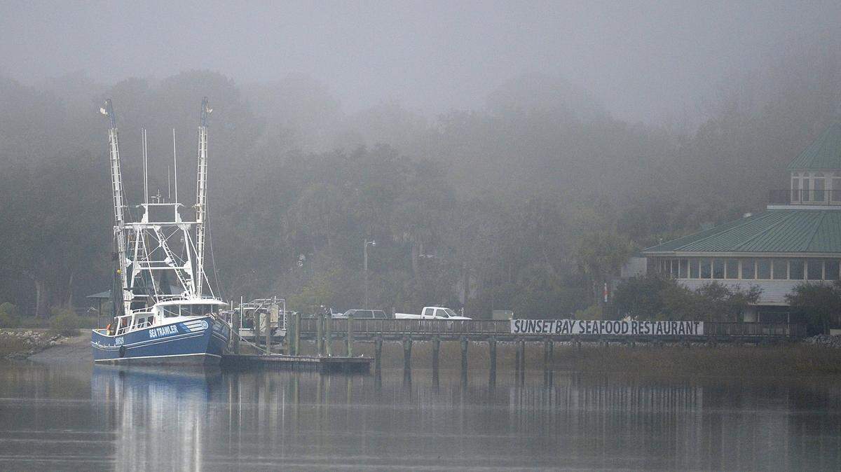 The Sea Trawler sits docked in fog on Mackays Creek the morning of Dec. 9, 2013.