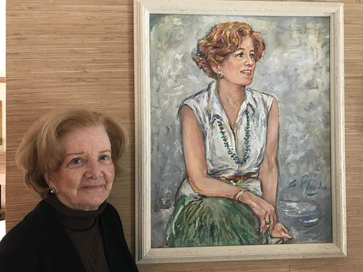 Rosemary Kimball poses next a portrait of herself painted by her friend, Suzanne McCullough Plowden, on Wednesday, Dec. 19, 2018, at her home in Sea Pines, on Hilton Head Island, S.C.