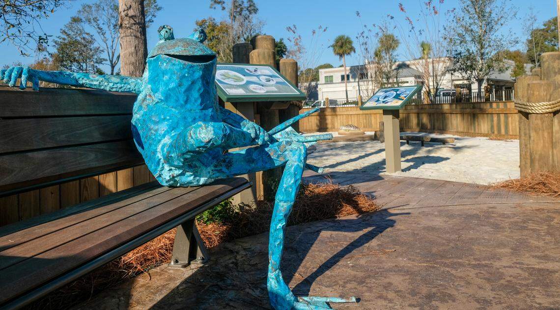 A welcoming frog beckons parents to take photos of their children on the bench which also includes interpretive signage about the wildlife in the Lowcountry as seen on Thursday, Dec. 10, 2020 at the newly opened Lowcountry Celebration Park on Hilton Head Island.