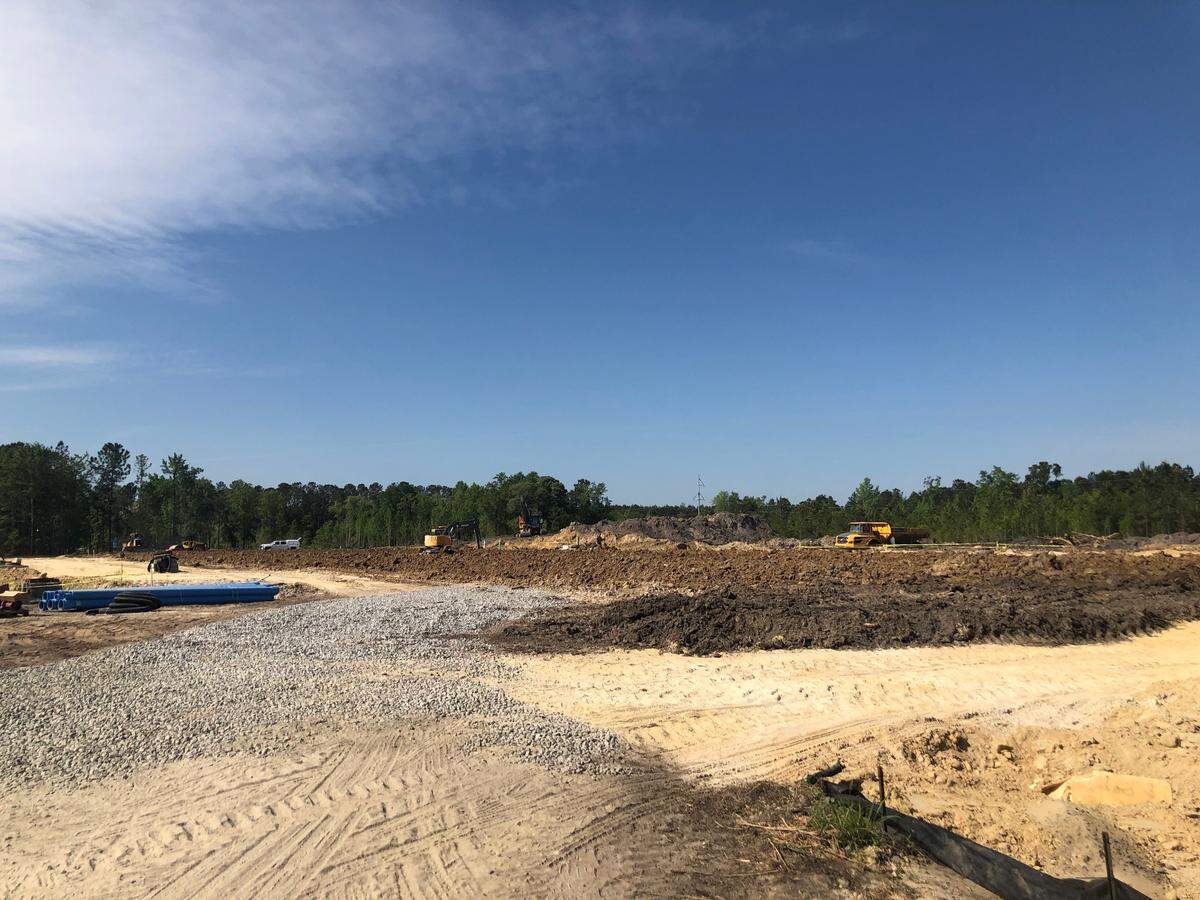 Construction crews tear up land on April 23, 2021 along S.C. 170. The property will be the site of a future strip mall, according to plans from Charter One Realty.