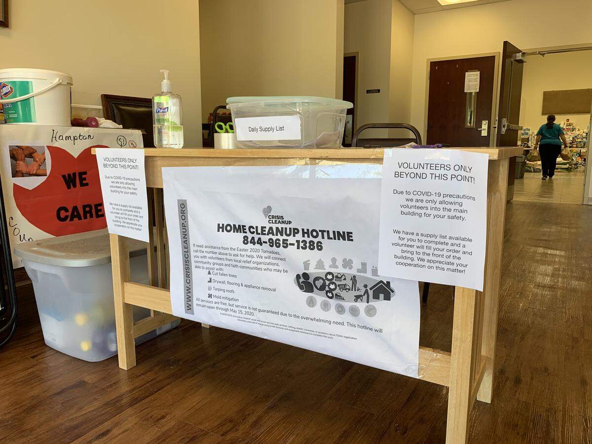 Notes on the front desk at the Nixville Baptist Church Family Life Center, which was collecting donations for tornado survivors, explains some precautions being taken to prevent the spread of coronavirus.