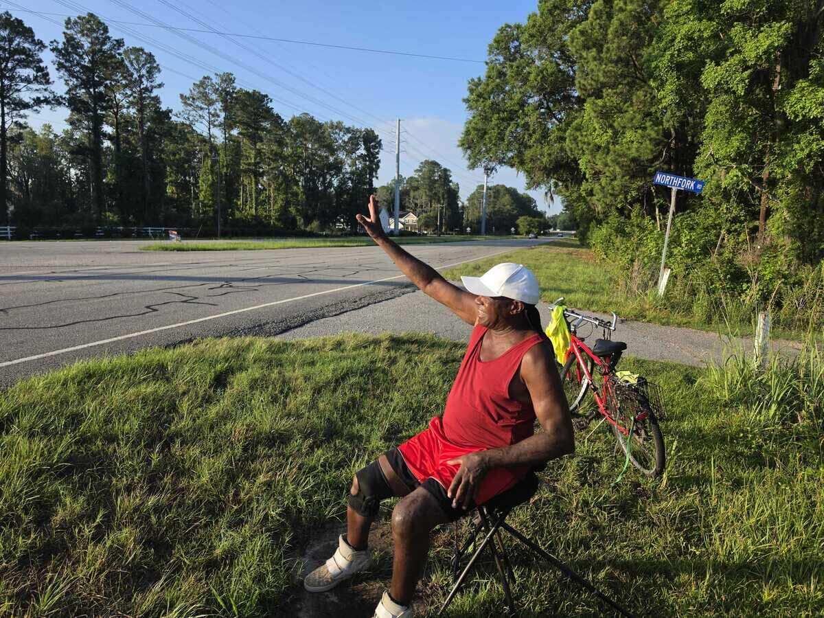 Thomas Allen Sr. acknowledges another driver on Highway 21. His waves acknowledging people driving on Highway 21 have been a been a blessing to passing motorists for years.