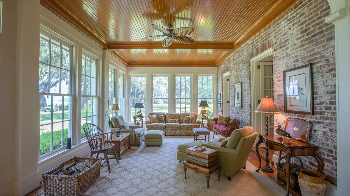 The sunroom inside Gregorie Neck’s main house. This room spans the river side of the estate. The main house is comprised of six bedrooms and eight bathrooms and is estimated to be approximately 6,000 square feet.