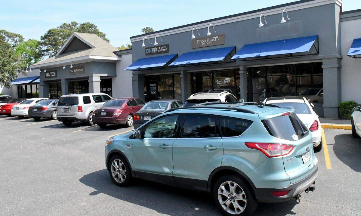 A car pulls into the lot where several businesses have been given notice that they must leave their current location on Mathews Drive on Hilton Head Island. The “Triangle Square” shopping center has been there since the 1970s.