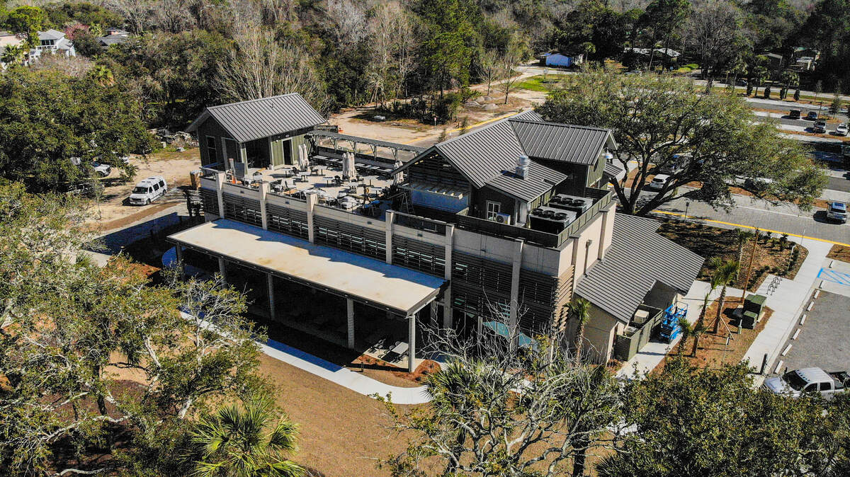 Benny’s Coastal Kitchen is located off Squire Pope Road with water views of Skull Creek and features an open kitchen concept with outdoor patio seating and a rooftop tapas bar on Hilton Head Island. The restaurant is the namesake of the late Benny Hudson, who operated a fleet of shrimp boats and opened the island’s first tourist-oriented seafood restaurant in 1968.