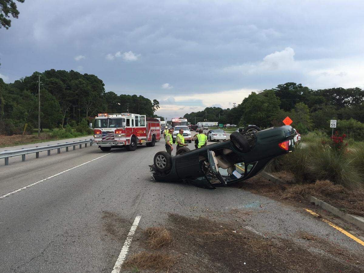 Beaufort/Port Royal firefighters respond to a vehicle rolled-over during a crash at the base of the Broad River Bridge on Tuesday, July 9, 2019.