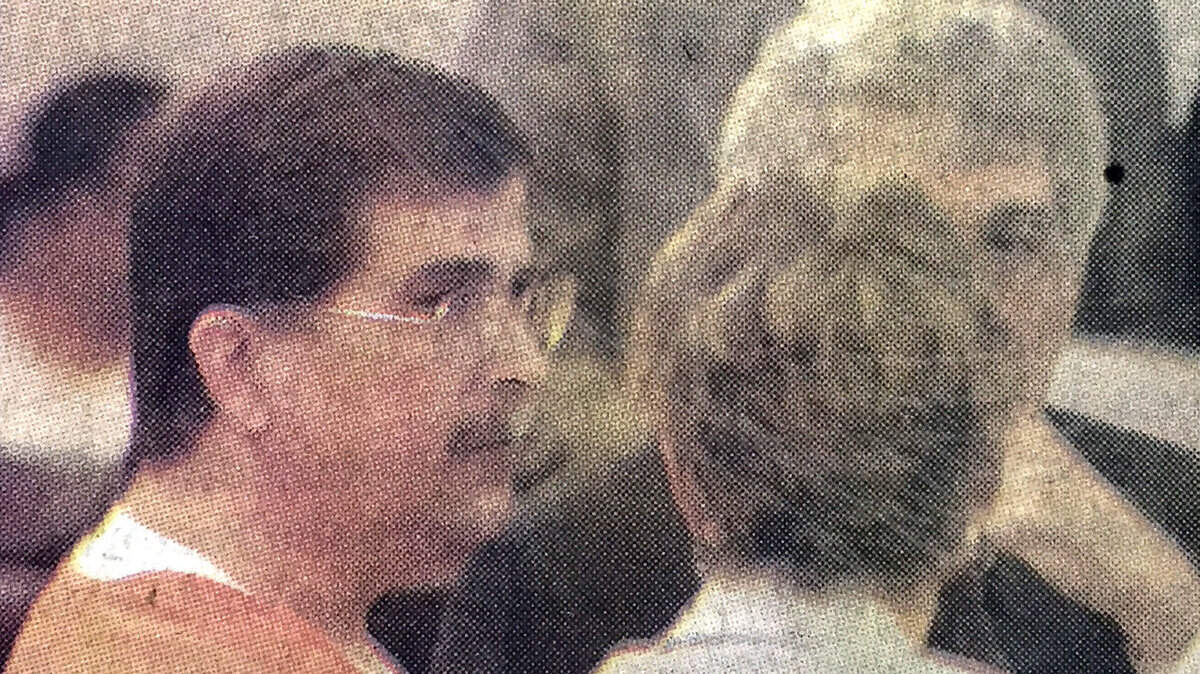 In this file photo from April 24, 2003, Phillip Underwood-Sheppard, left, talks with his attorneys before he entered a plea bargain  at the Beaufort County Courthouse. He was sentenced to 25 years by Judge Jackson Gregory.
