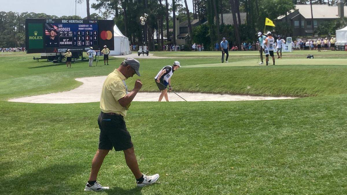 A volunteer walks in front of the Harbour Town Golf Links 9th green on April 16, 2023, just minutes before another one of the tournament’s volunteers was struck in the head by a golf ball.