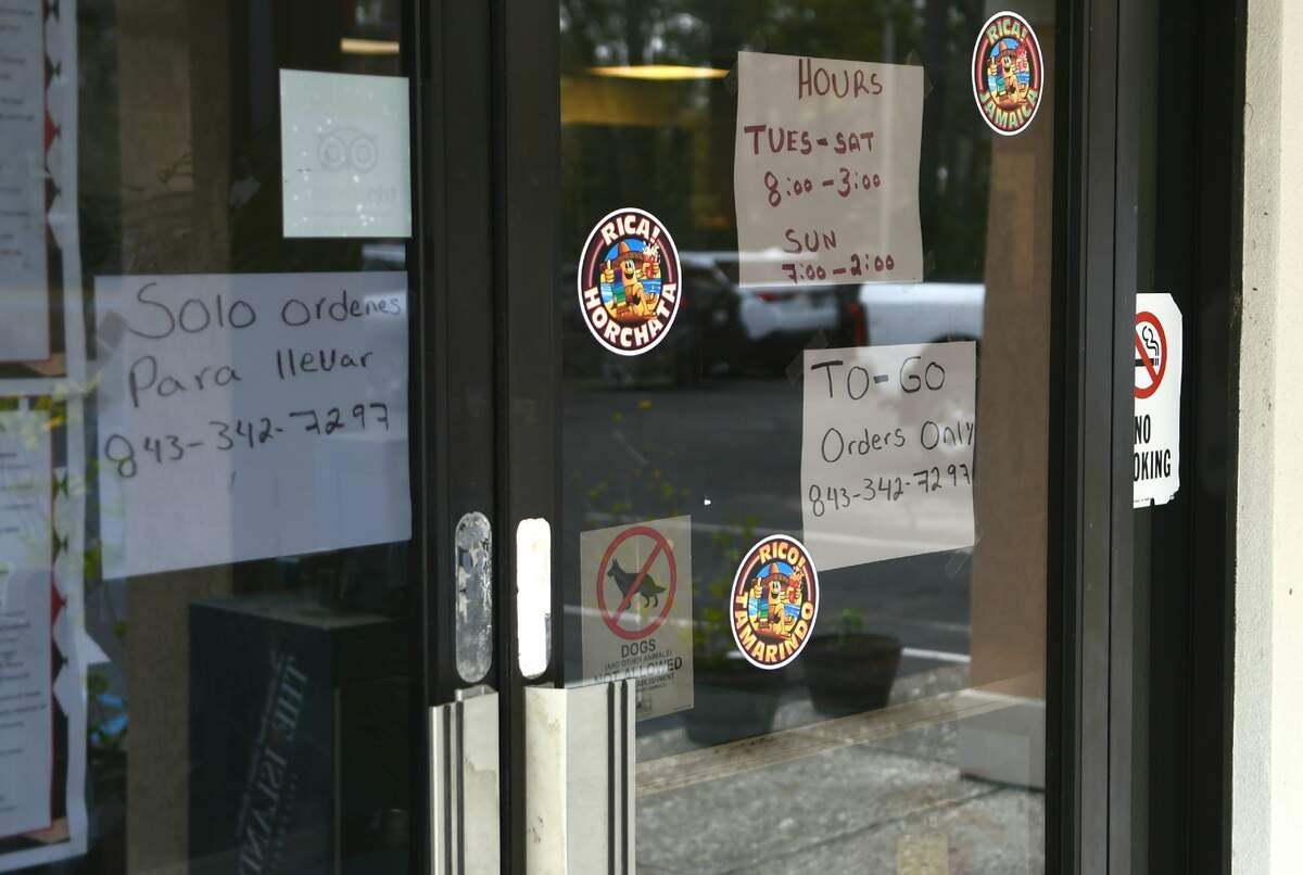 Signage on the doors of Ray’s Cafe on Northridge Drive tells customers food orders are for carry out only as seen on Wednesday March 18, 2020 on Hilton Head Island. Wednesday marked the first day after SC Gov Henry McMaster ordered restaurants and bars closed for sit down guests.