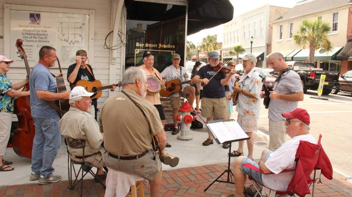 Musicians gather on a corner along Bay Street for Beaufort’s First Friday After Five.
