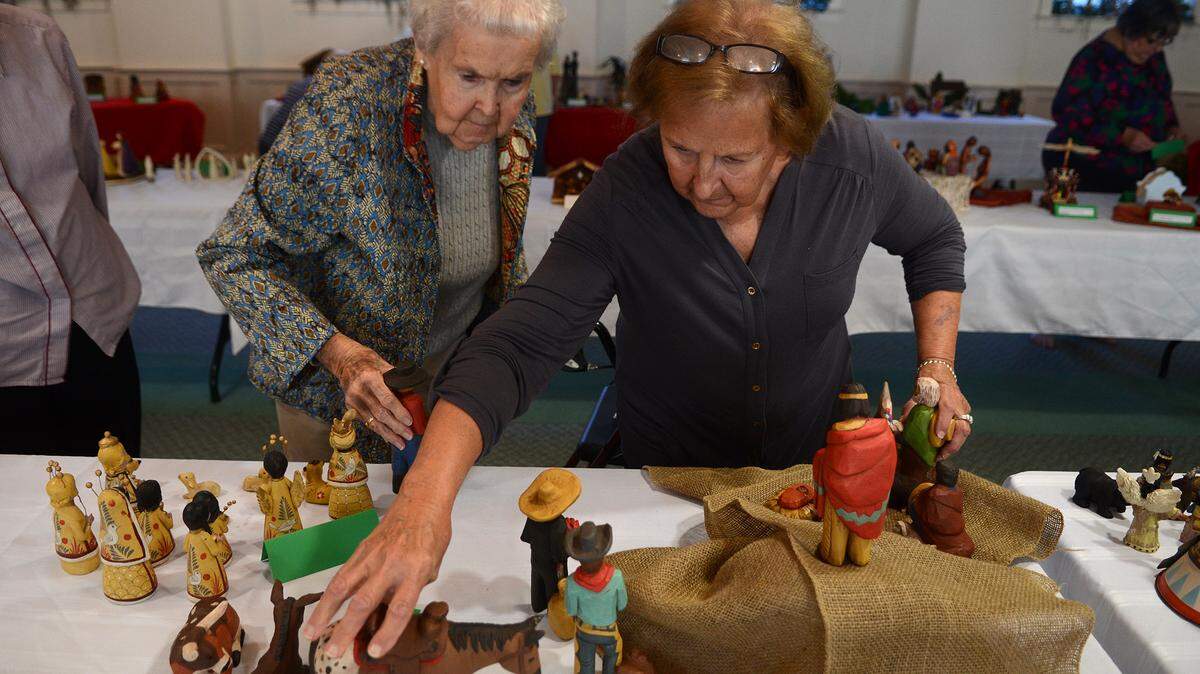 Marge Boyle, right, and Marion Leach, both of Beaufort, arrange one of the nativity scenes as the Presbyterian Women set up for the 5th annual Nativity Celebration on Thursday afternoon in the basement of the First Presbyterian Church Fellowship Hall in Beaufort.  The event will be open to the public from 10 a.m. to 3 p.m. on Friday, Dec. 11 through Dec. 13.