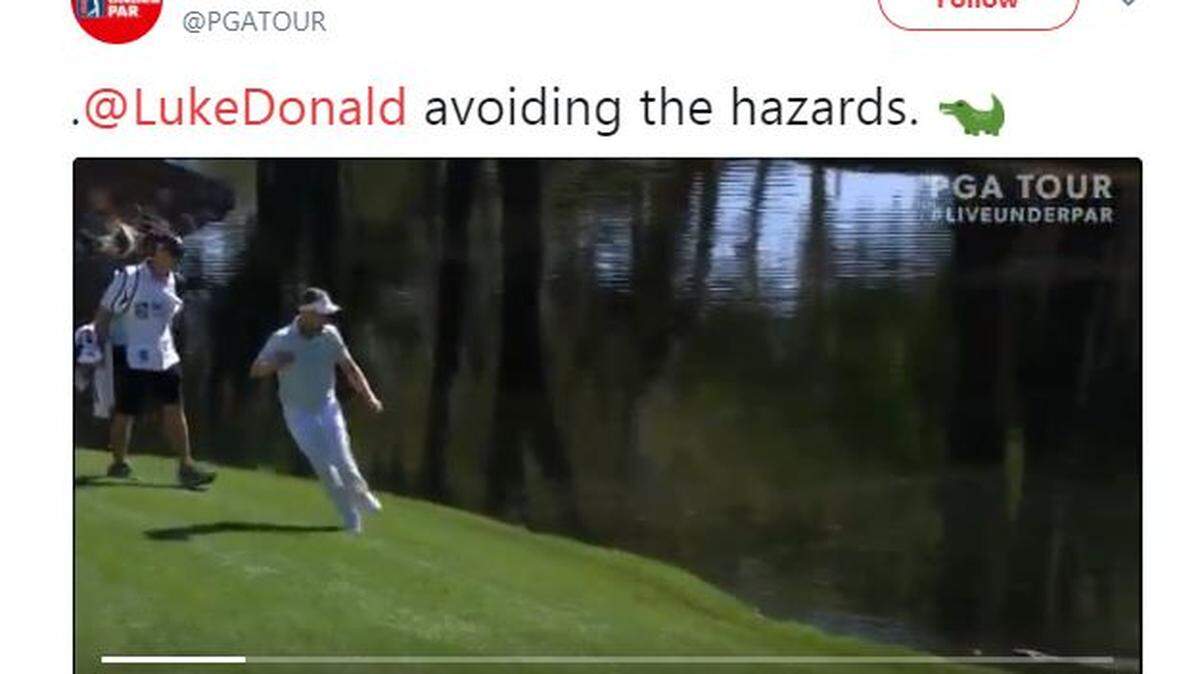 Luke Donald gets freaked out by an alligator at Harbour town at the RBC Heritage Thursday April 12, 2018.