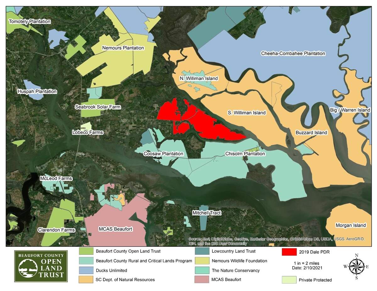 Red shows the location of the 2,068-acre Oak Point property, purchased by Beaufort County and the Department of Defense and protected by a conservation easement.