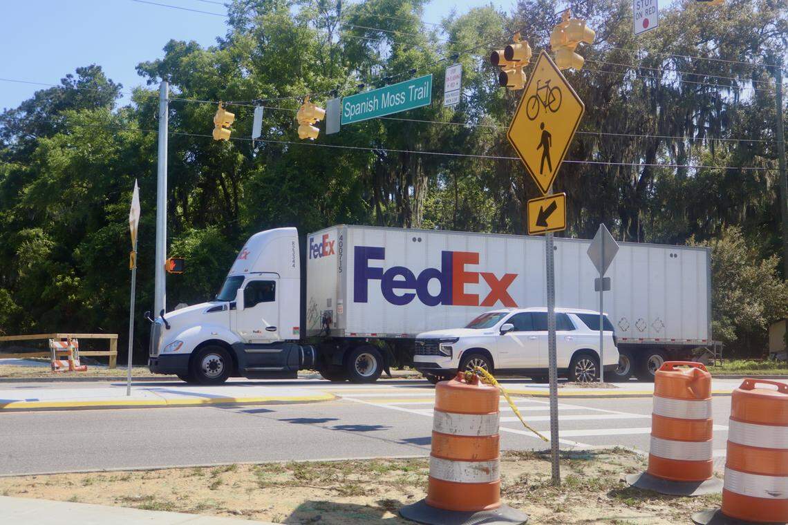 Motorists on Ribaut Road pass a newly installed crosswalk for bicyclists and pedestrians on April 17, 2026. The high-intensity activated crosswalk — also known as a HAWK signal — is part of the expansion of the Spanish Moss Trail into downtown Port Royal.