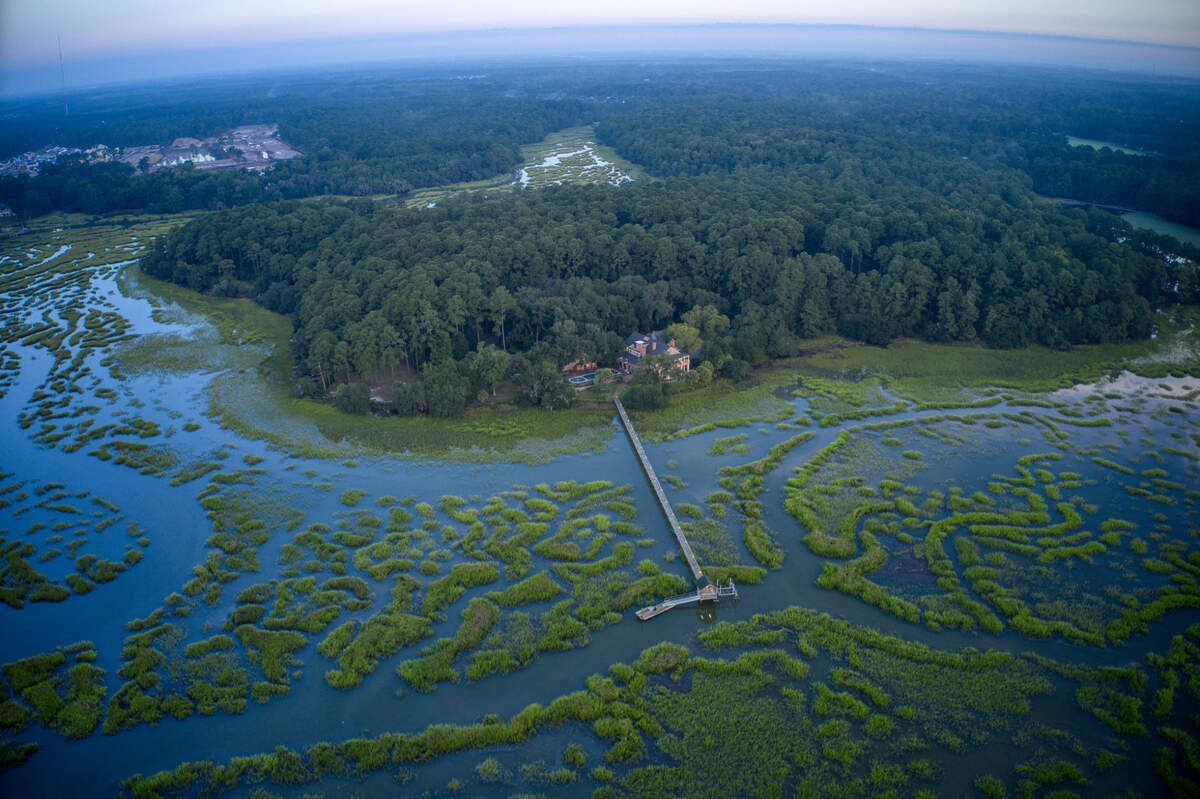 Aerial views of the dock and marsh-front property at 1 Heffalump Road in Okatie, SC.