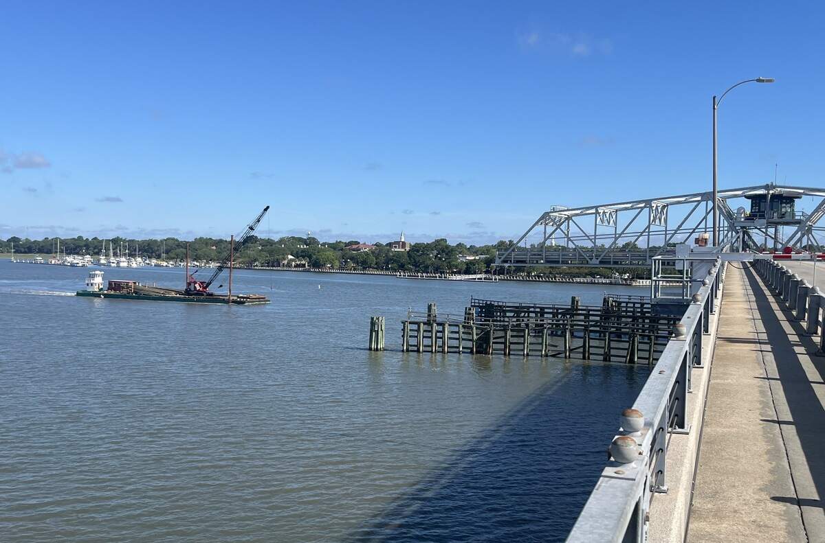 The Woods Memorial swing span bridge opens to let Beaufort River traffic pass through while bridge traffic waits. A Beaufort man has developed a phone app that provides notifications when the bridge closes.