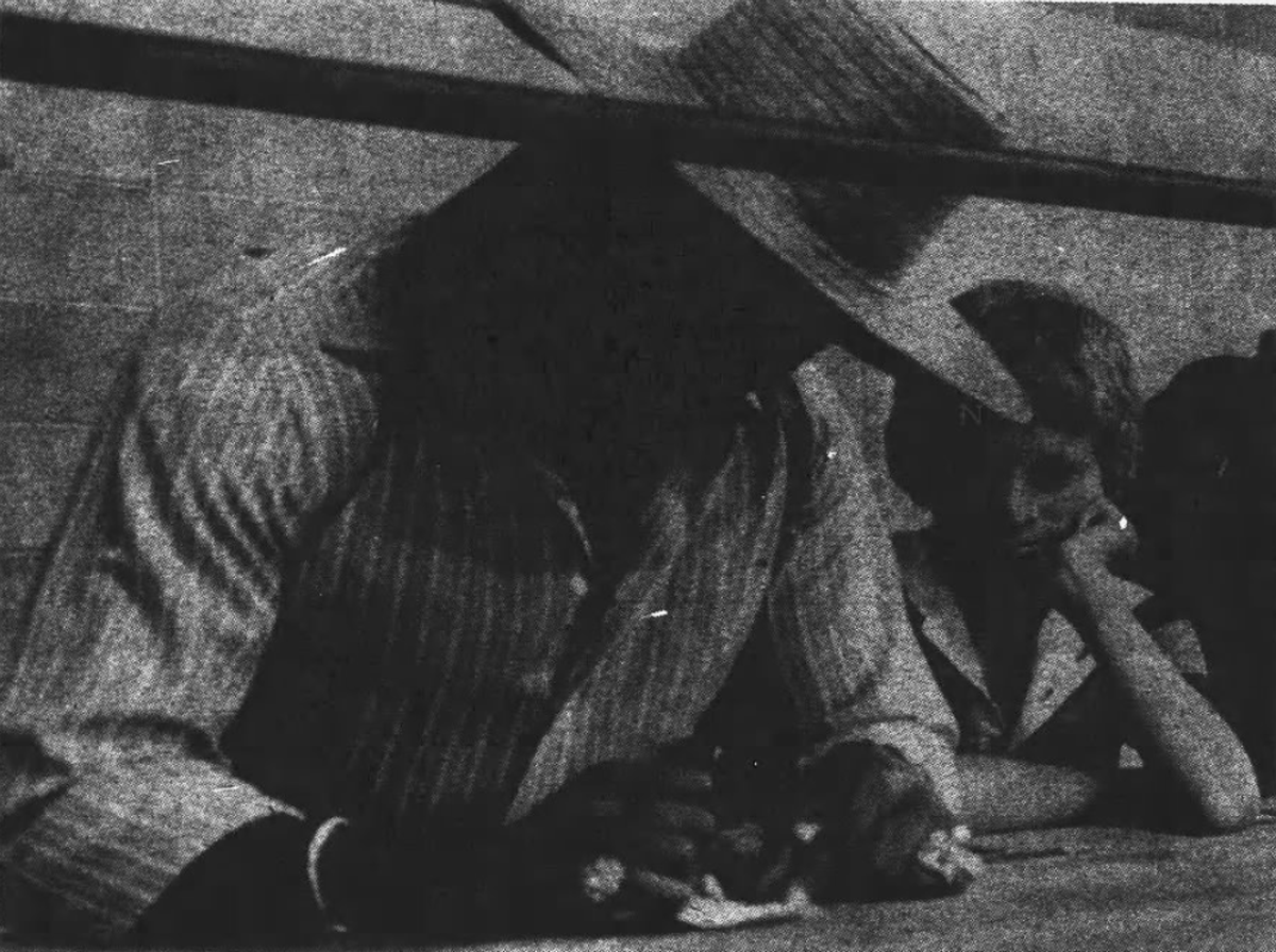 Heavyweight champion Leon Spinks flashes diamonds as he gives autographs to a fan at his Hilton Head training camp in July 1978.