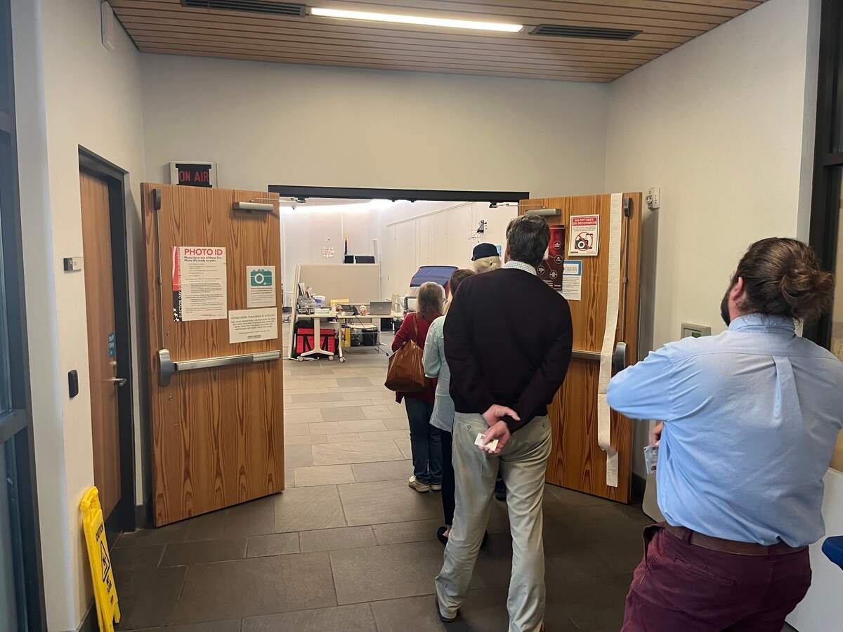 Residents wait to enter the early voting center at the St. Helena Branch Library on St. Helena Island Friday morning.
