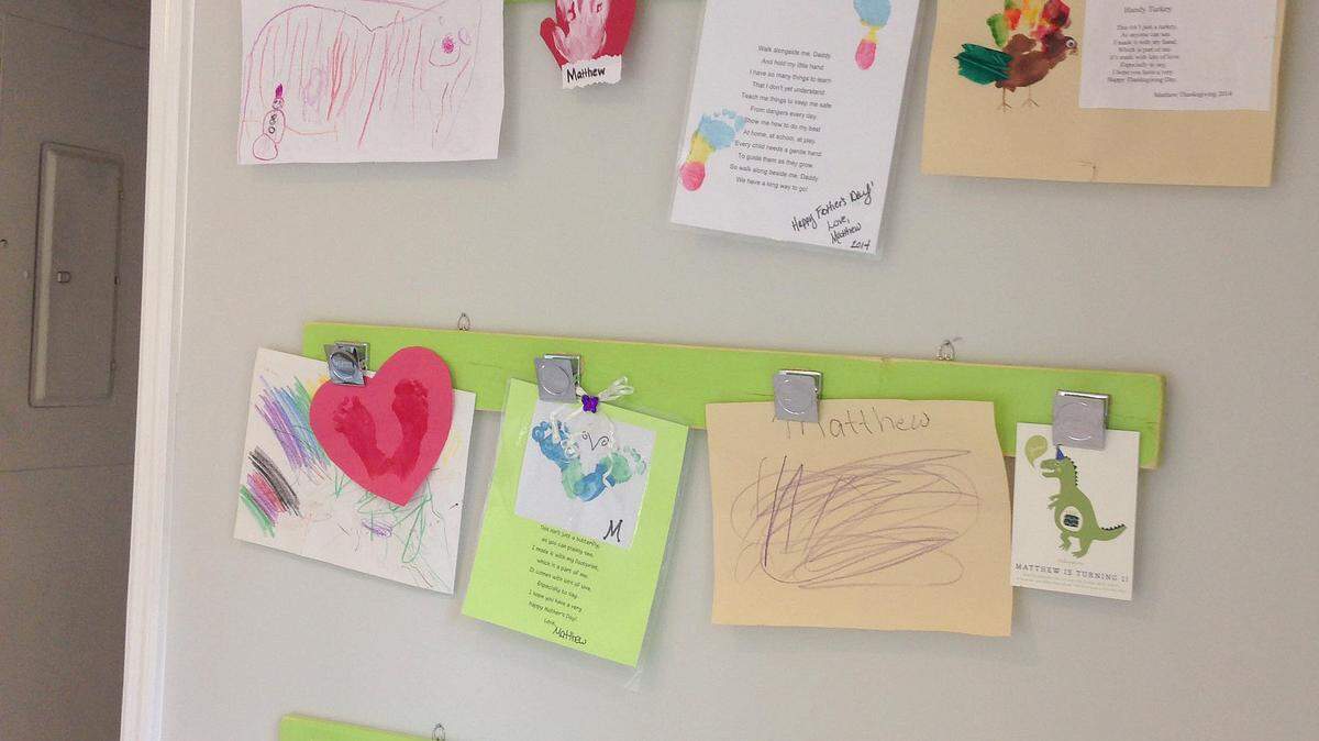 Magnets won't stick to their refrigerator so Susan DeLano of Hilton Head Island and her husband created an art wall to display their son's pictures.
