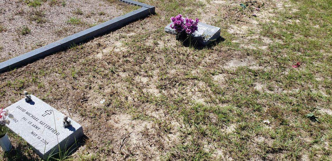 The ground next to Gloria Satterfield’s grave in Johnson-St. Paul Cemetery in Hampton does not appear disturbed as of the morning of Thursday, Sept. 23, 2021. The Hampton County Coroner declined to comment when asked if Satterfield would be exhumed and an autopsy done in relation to the criminal investigation of her death. She worked as a housekeeper and nanny for the Murdaugh family for over 20 years.