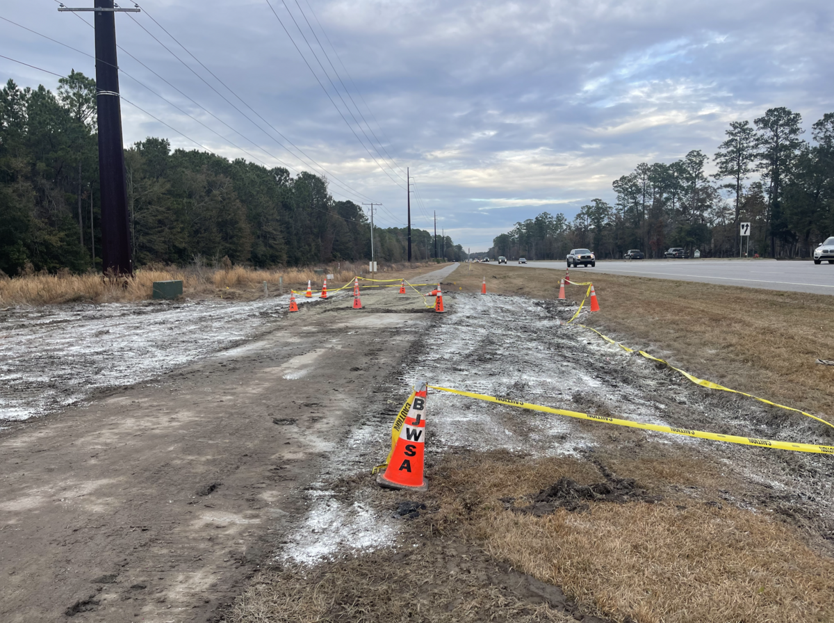 BJWSA cones and caution tape mark off an area off Okatie Highway, across from the entrance of Lawton Station, where the wastewater was released.
