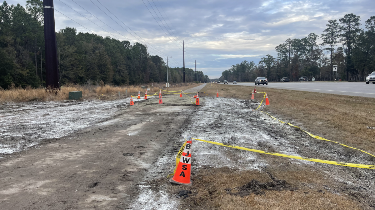 BJWSA cones and caution tape mark off an area off Okatie Highway, across from the entrance of Lawton Station, where the wastewater was released.