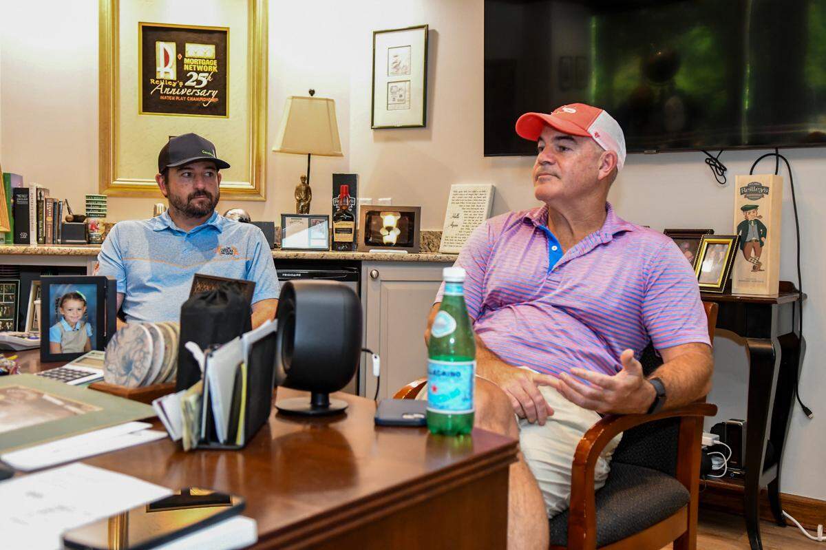 Youngest son Thomas Reilley, left, sits in his father’s office at Coastal Restaurants and Bars, with his oldest brother, Keith Reilley on May 8, 2025, to reminisce about their father Tom Reilley on Hilton Head Island.