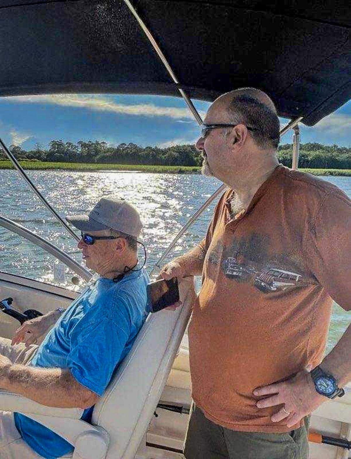 Pictured in this handout photo are John Leath Zentmeyer, right, standing next to Rick Montgomery as he drives the boat on June 27, 2025, to go to dinner at Skull Creek Dockside on Hilton Head Island. North Carolina residents Zentmeyer and his wife, Debra Ann Zentmeyer would survive the after-dinner boat crash that killed Montgomery and his wife Patsy Montgomery after their boat struck a reflective day marker in the Intracoastal Waterway, capsizing the vessel.